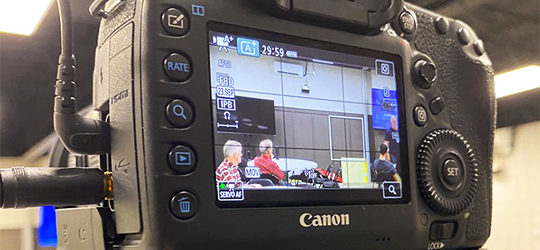 Camera framing up a workshop and teaching