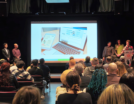 An image of a group of students presenting their live client project at industry night