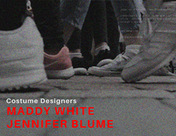 A stillframe from the final video portraying a large group of people walking down the road with more crew member names